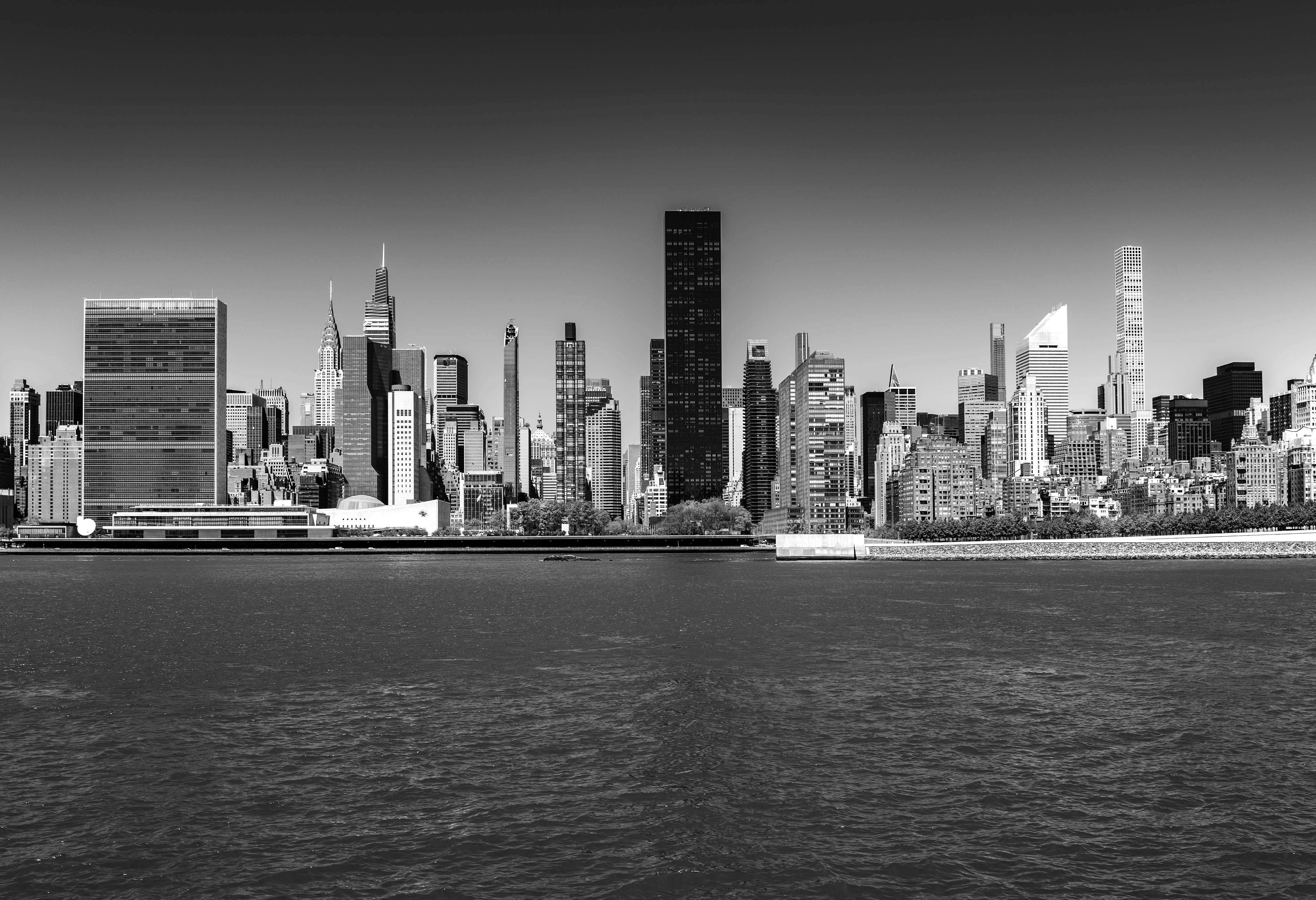 grayscale photo of city skyline during daytime